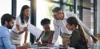 A group of people in a meeting