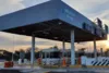 A gas station with a large rectangular sign under a clear sky, featured in Kapsch TrafficCom's reference projects for advanced mobility solutions.